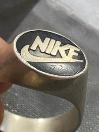 Vintage sterling silver NIKE black enameled logo
