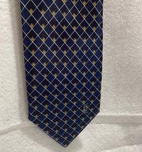 Blue  Ives St.Laurent neck tie with white and blak small geometric squares