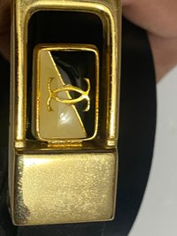 Vintage Two Tone Thin Cartier Logo Belt Buckle on black leather belt