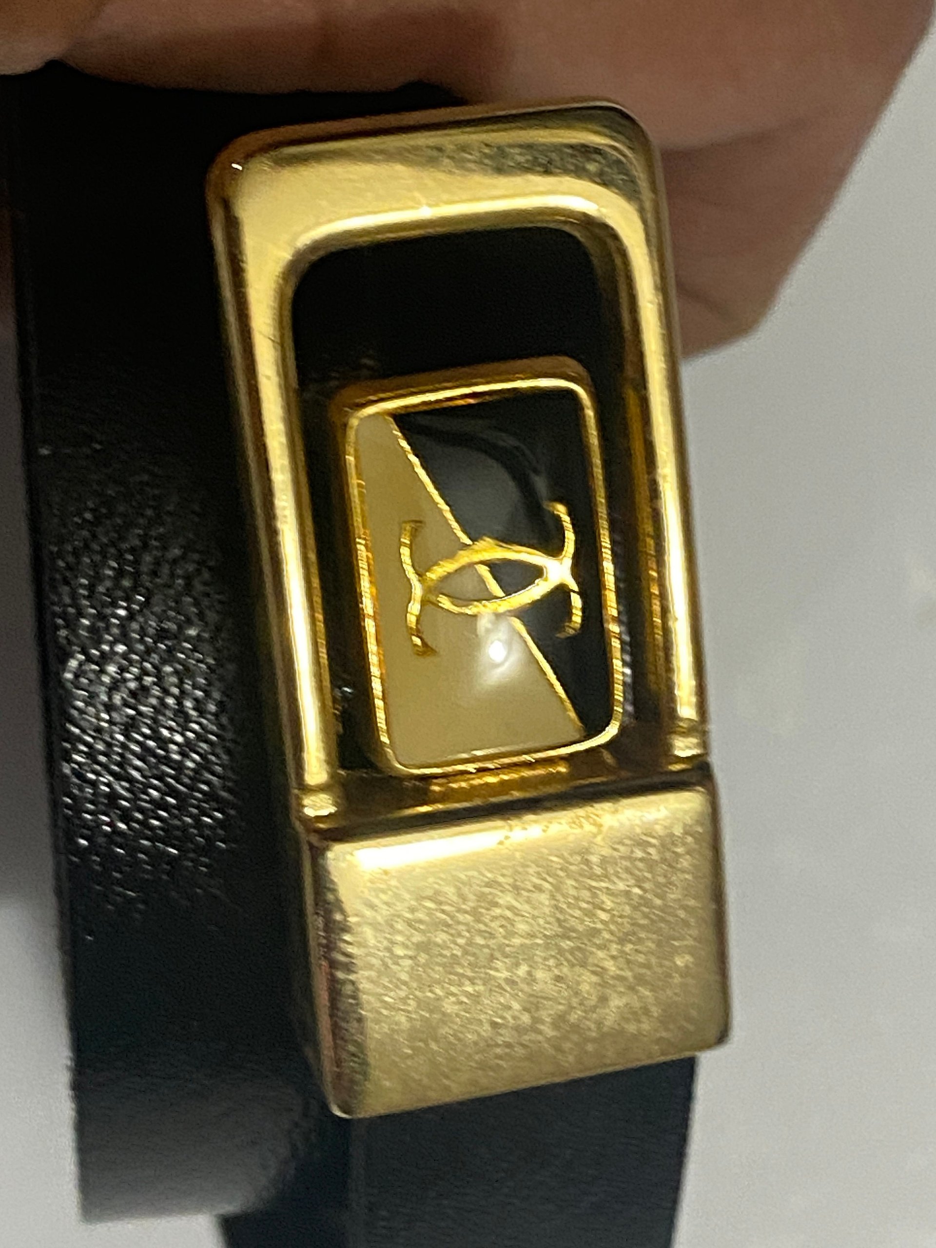 Vintage Two Tone Thin Cartier Logo Belt Buckle on black leather belt