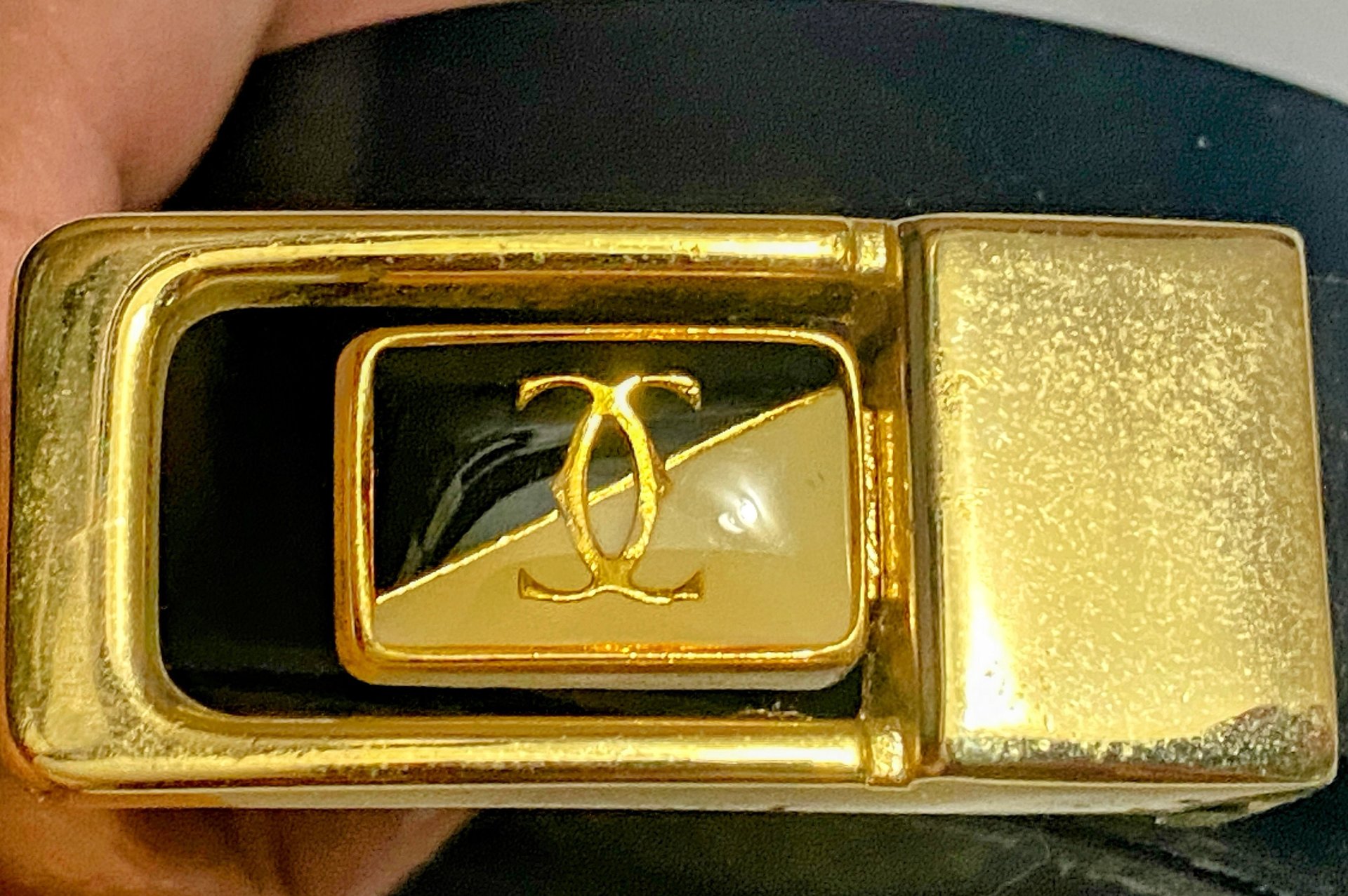 Vintage Two Tone Thin Cartier Logo Belt Buckle on black leather belt