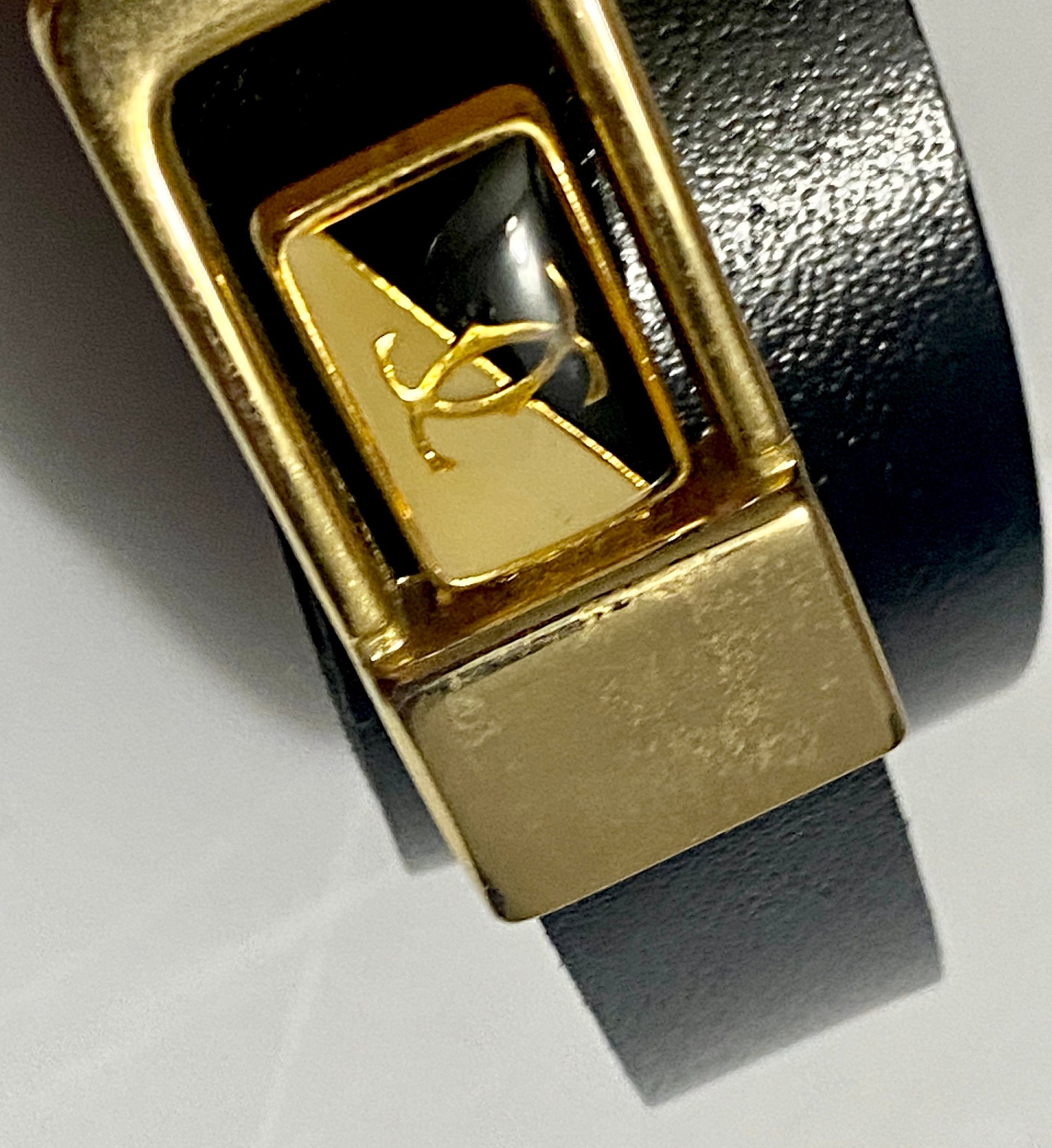 Vintage Two Tone Thin Cartier Logo Belt Buckle on black leather belt
